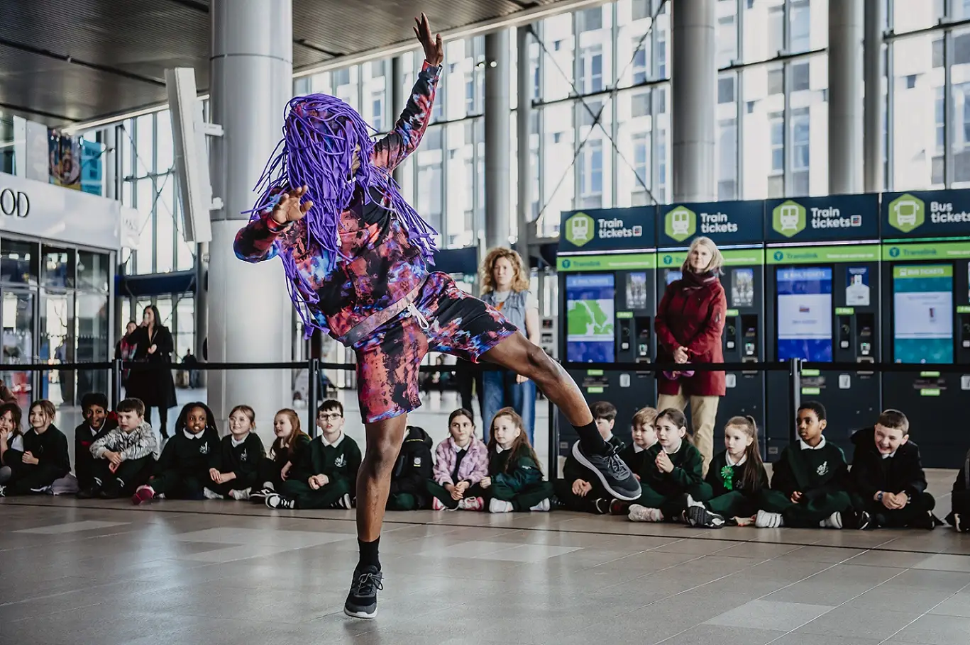 A photo of a dance performance at Belfast Grand Central Station as part of the Belfast Children's Festival.
