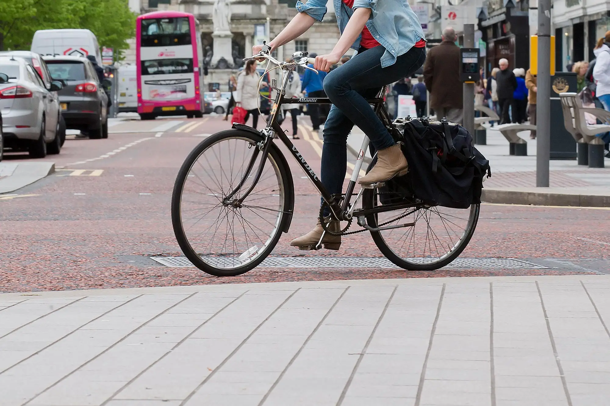 bus cycling bicycle bike cycle A photo of a person on a bike with a Translink Metro bus in the background