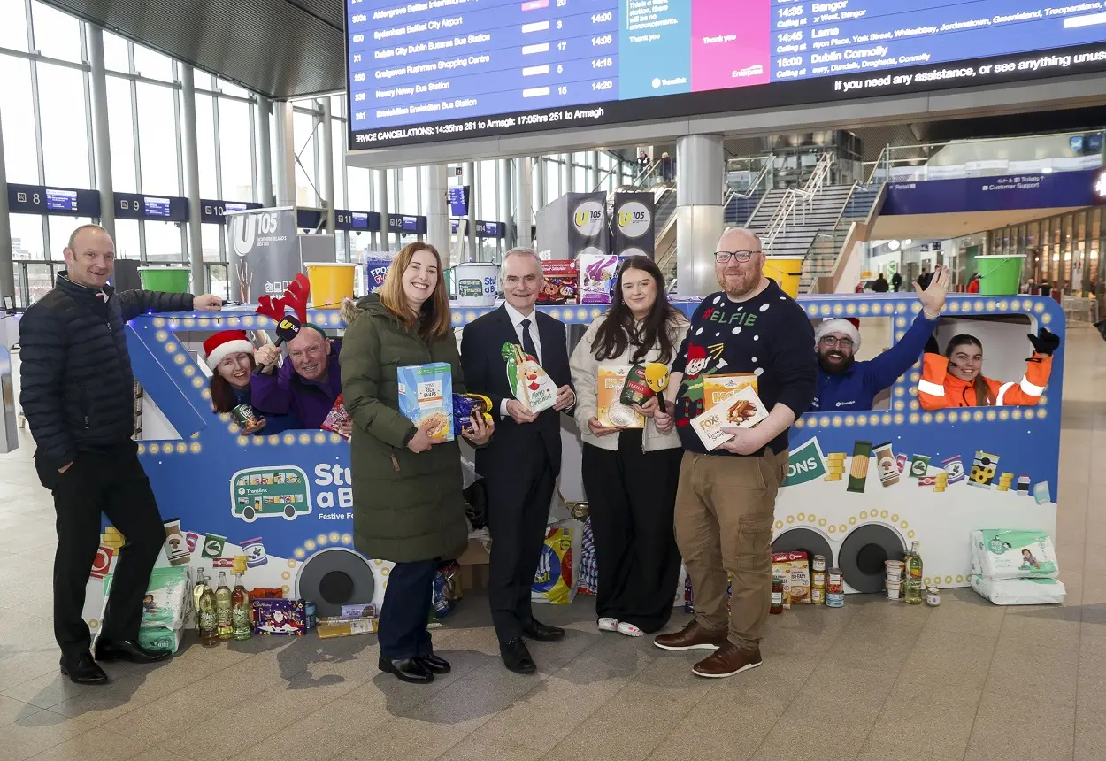 Translink staff collecting donations for the Christmas Stuff a Bus campaign.
