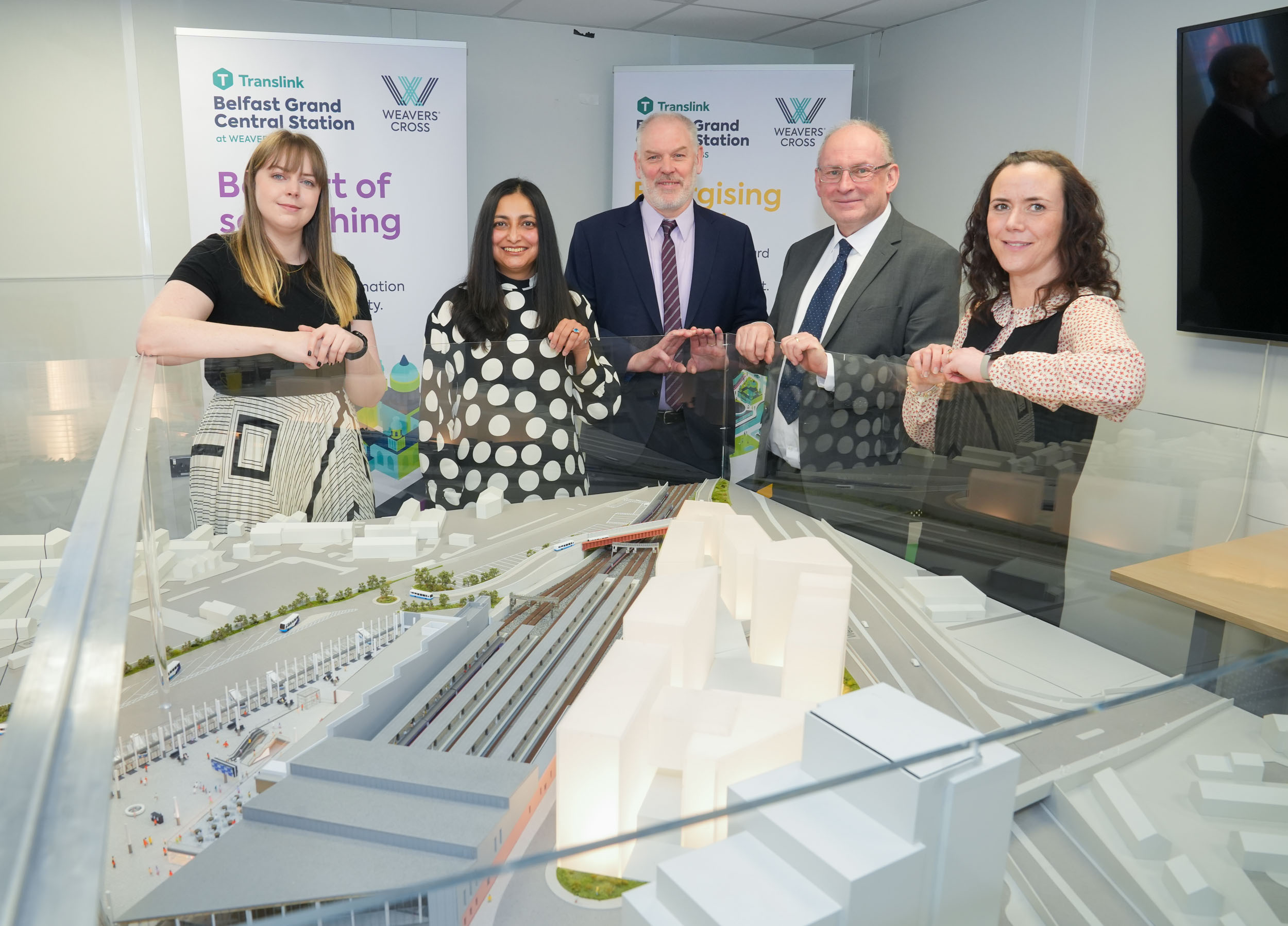 Consumer Council staff viewing a model of Belfast Grand Central Station